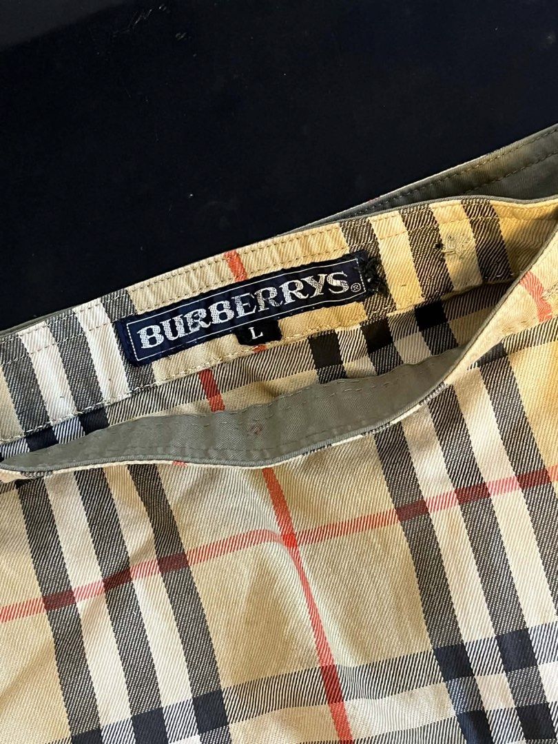 Burberrys Nova Check Wrap Skirt Size L (Category: Luxury Apparel) located in Meycauayan. Submitted by venelyngum56325 (Listing ID 1446389343, Image 2). Description: - Classic Burberrys Nova Check Wrap Skirt - Size: Large (L) - Features the iconic Burberry check pattern - Side button closure for a secure fit - Versatile for casual or smart casual outfits - A timeless addition to your wardrobe.