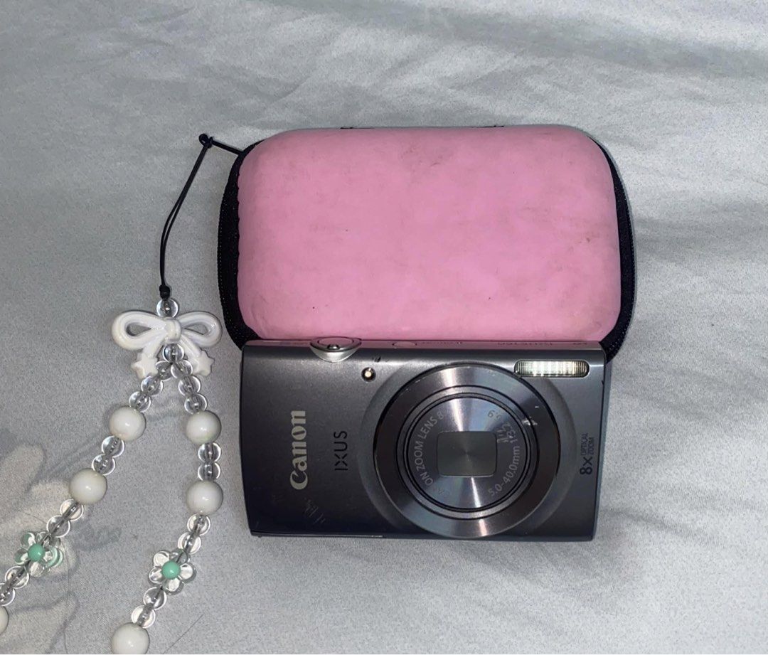 Canon Ixus 160 (Category: Cameras) located in San Rafael. Submitted by kuyabribri (Listing ID 1446353479, Image 2). Description: - Excellent condition - With charger and pouch na po - Slight dents on the pic - No hidden issue - 10/10 pic quality.