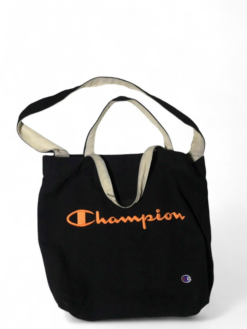 Champion Tote Bag Black Orange Logo (Category: Tote Bags) located in Manila. Submitted by ronmark (Listing ID 1446379321, Image 1). Description: - Classic black Champion tote bag - Iconic embroidered orange logo on front - Neutral beige straps - Ideal for everyday use, books, or groceries - Simple and durable design.