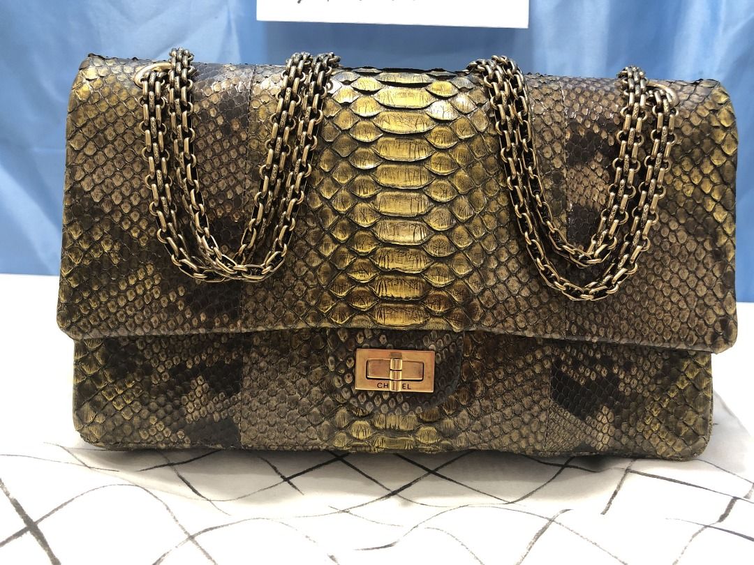 Chanel Limited Gold Python 226 Classic Reissue 2.55 Flap Bag - Jumbo (Category: Luxury Bags & Wallets) located in Quezon City. Submitted by mamaloveaminah (Listing ID 1446495506, Image 2). Description: - Chanel Limited Gold Python 226 Classic Reissue 2.55 Flap Bag - Jumbo - Dimensions (W × H × D) : 28 × 18 × 8 cm - Leather: Metallic Gold Python (Exotic) - Size 226 - Jumbo - Serial: 15531178 - Collection/Series: 15 - Production year: 2011 - "CHANE
