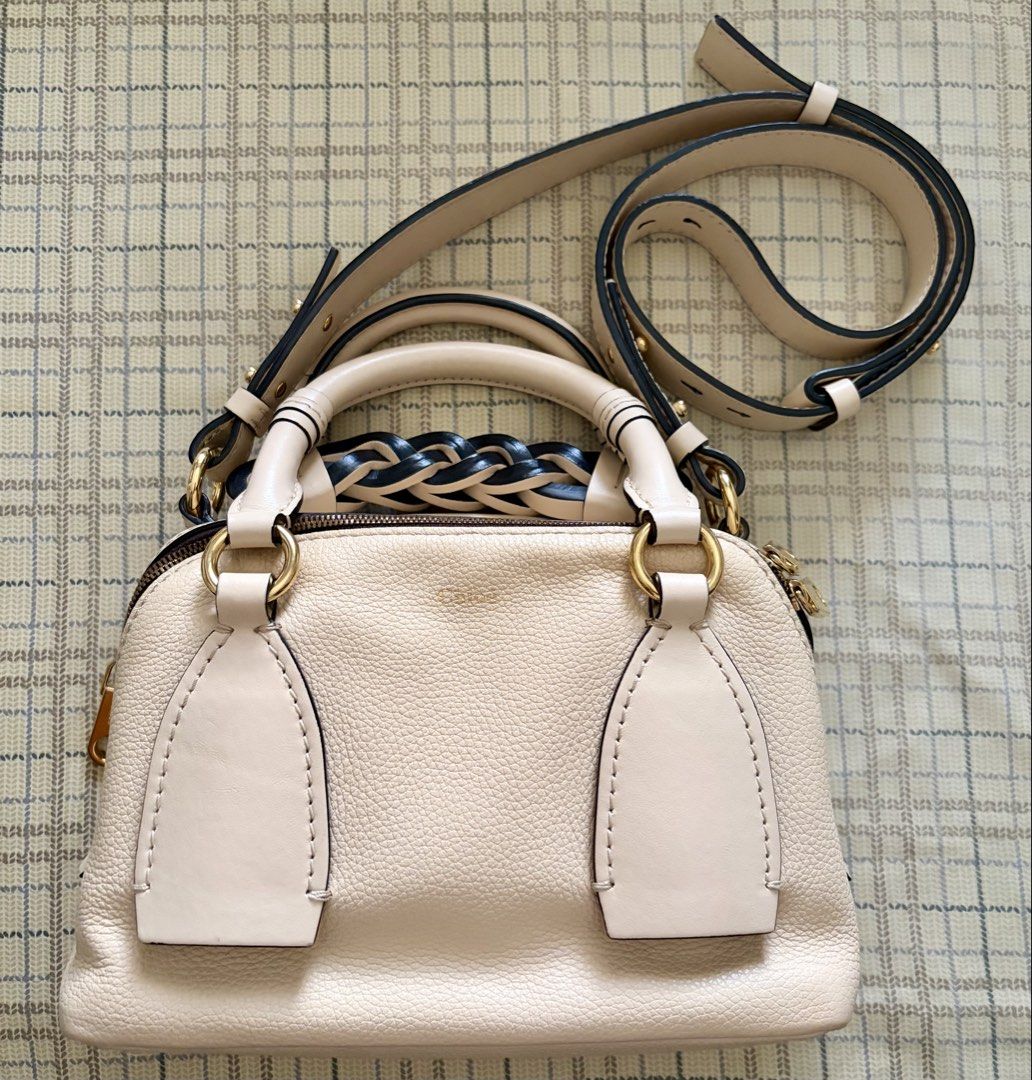 Chloe Daria bag (Category: Luxury Bags & Wallets) located in Taguig. Submitted by museumile (Listing ID 1446356259, Image 1). Description: Item: Authentic Chloe Daria bag in cream, grained leather Purchase history: Bought in the US Condition: Almost new & no issues. Stored very well; no cabinet smell. Leather & lining in very good condition. Inclusion: Adjustable strap Price: P25,000 RFS: Not using anymore Size: 9x6x4 inches SF c/o buyer Meet up 