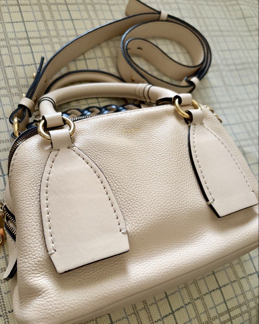 Chloe Daria bag (Category: Luxury Bags & Wallets) located in Taguig. Submitted by museumile (Listing ID 1446356259, Image 2). Description: Item: Authentic Chloe Daria bag in cream, grained leather Purchase history: Bought in the US Condition: Almost new & no issues. Stored very well; no cabinet smell. Leather & lining in very good condition. Inclusion: Adjustable strap Price: P25,000 RFS: Not using anymore Size: 9x6x4 inches SF c/o buyer Meet up 