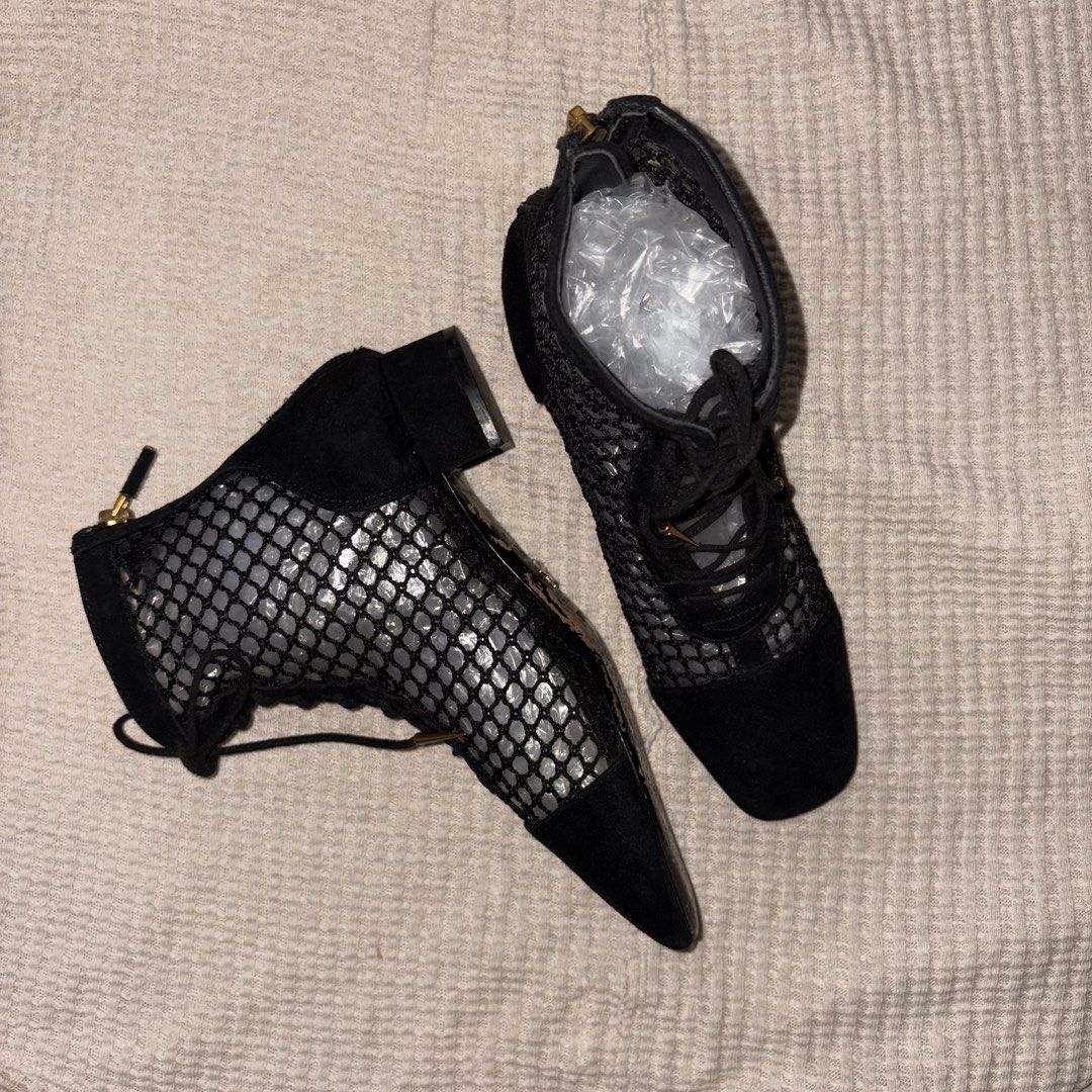 Christian Dior Black Naughtily-D Ankle Boots (Category: Boots) located in Paranaque City. Submitted by angrycar (Listing ID 1446535341, Image 1). Description: 📌 Item Name: Christian Dior Black Naughtily-D Ankle Boots 📌 Description: Stunning pair of Christian Dior Naughtily-D ankle boots, characterized by their unique black mesh fishnet upper and black suede cap-toe design. These boots feature a lace-up front with gold-tone accents, a functional