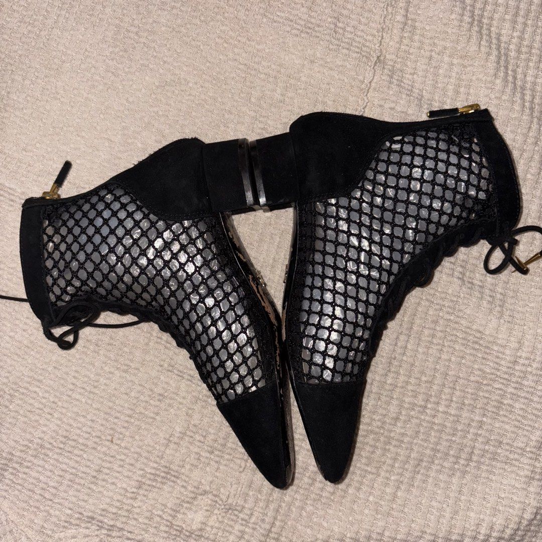Christian Dior Black Naughtily-D Ankle Boots (Category: Boots) located in Paranaque City. Submitted by angrycar (Listing ID 1446535341, Image 3). Description: 📌 Item Name: Christian Dior Black Naughtily-D Ankle Boots 📌 Description: Stunning pair of Christian Dior Naughtily-D ankle boots, characterized by their unique black mesh fishnet upper and black suede cap-toe design. These boots feature a lace-up front with gold-tone accents, a functional