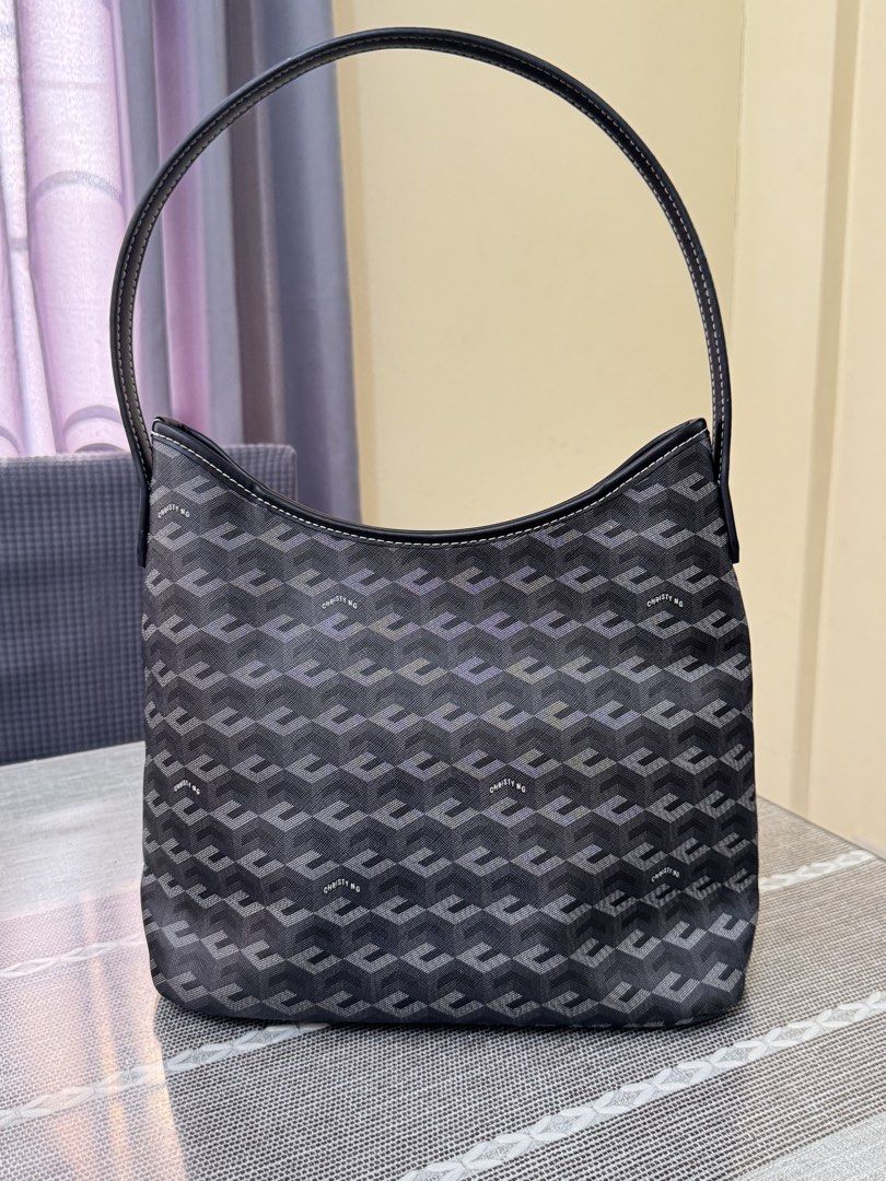 Christy Ng Alesso Medium (Category: Luxury Bags & Wallets) located in Batangas. Submitted by bagsbyann (Listing ID 1446427425, Image 2). Description: - Christy DG monogram hobo bag - Dark grey and black pattern - Leather strap and trim - Interior zippered pocket - Snap closure - Monogram pattern on the bottom - Great everyday bag.