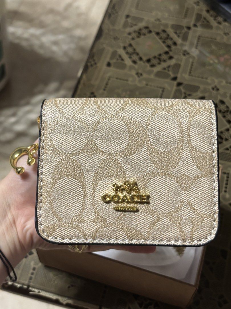 Coach Mini Sling Bag Beige (Category: Purses & Pouches) located in Manila. Submitted by skyfl4kesdeclutter (Listing ID 1446448307, Image 1). Description: - brand new purchase - bought two of the same kind by accident will be selling the other - super cute! .