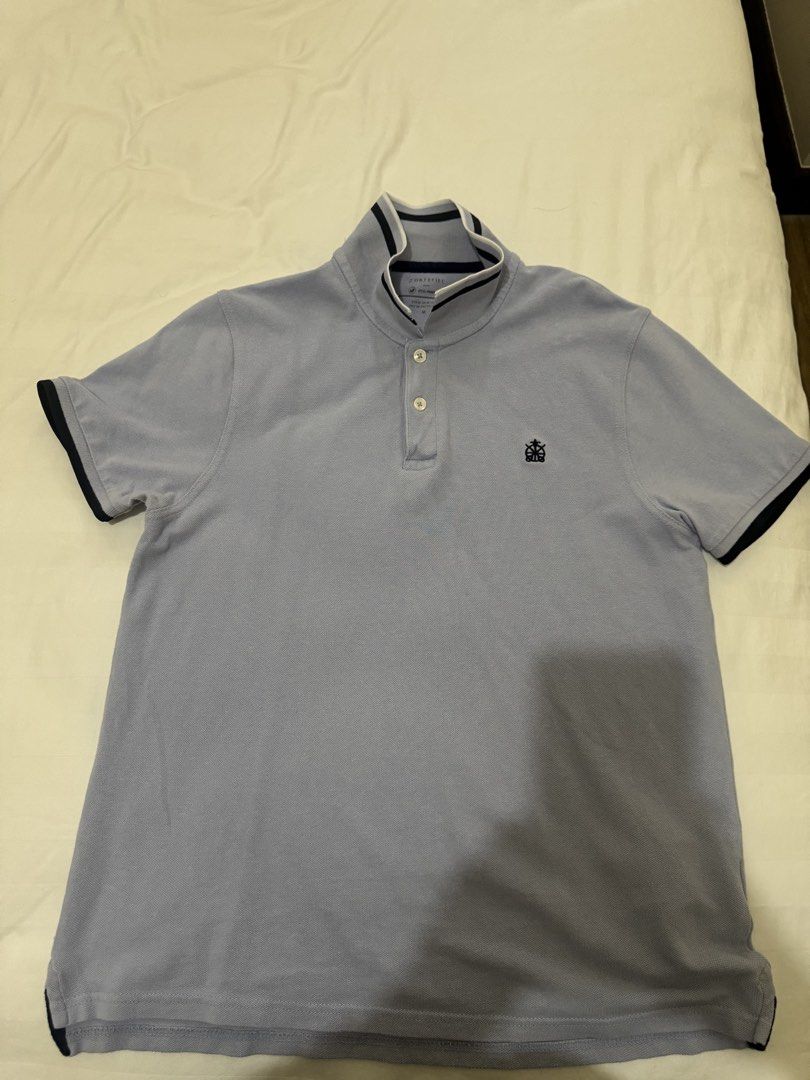 Cortefiel Light Blue Polo Shirt (Category: Tshirts & Polo Shirts ) located in Manila. Submitted by pjguillermo (Listing ID 1446382769, Image 2). Description: - Polo Shirt - Light Blue Color - Embroidered Brand Logo on Chest - Button-Up Neckline - Contrasting Collar and Sleeve Trim - Short Sleeves - Ideal for Casual Wear.