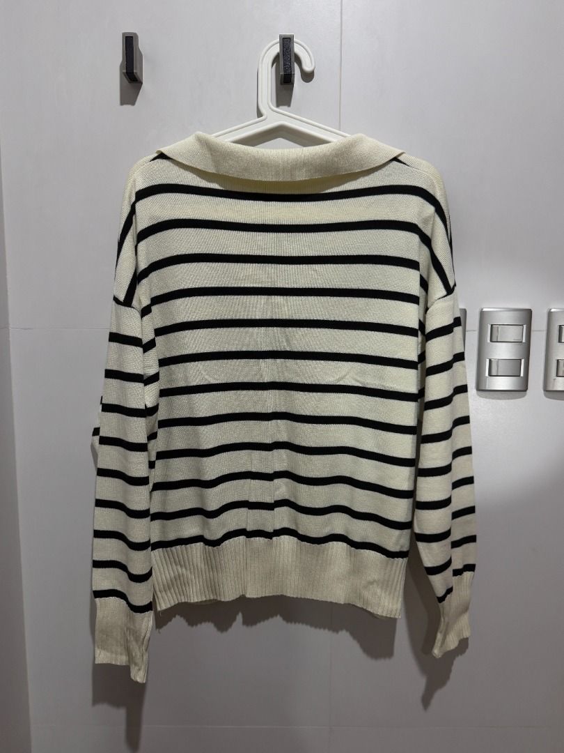 Cream and Black Striped Collared Sweater (Category: Longsleeves) located in Mandaluyong City. Submitted by kayechx (Listing ID 1446496393, Image 2). Description: - Cream sweater with black horizontal stripes - Features a collared neckline - Lightweight knit fabric - Ideal for layering or wearing solo - Versatile styling with jeans or skirts - Bought in Korea - price SLIGHTLY negotiable, but not by a lot huhu already selling cheap since i need clo