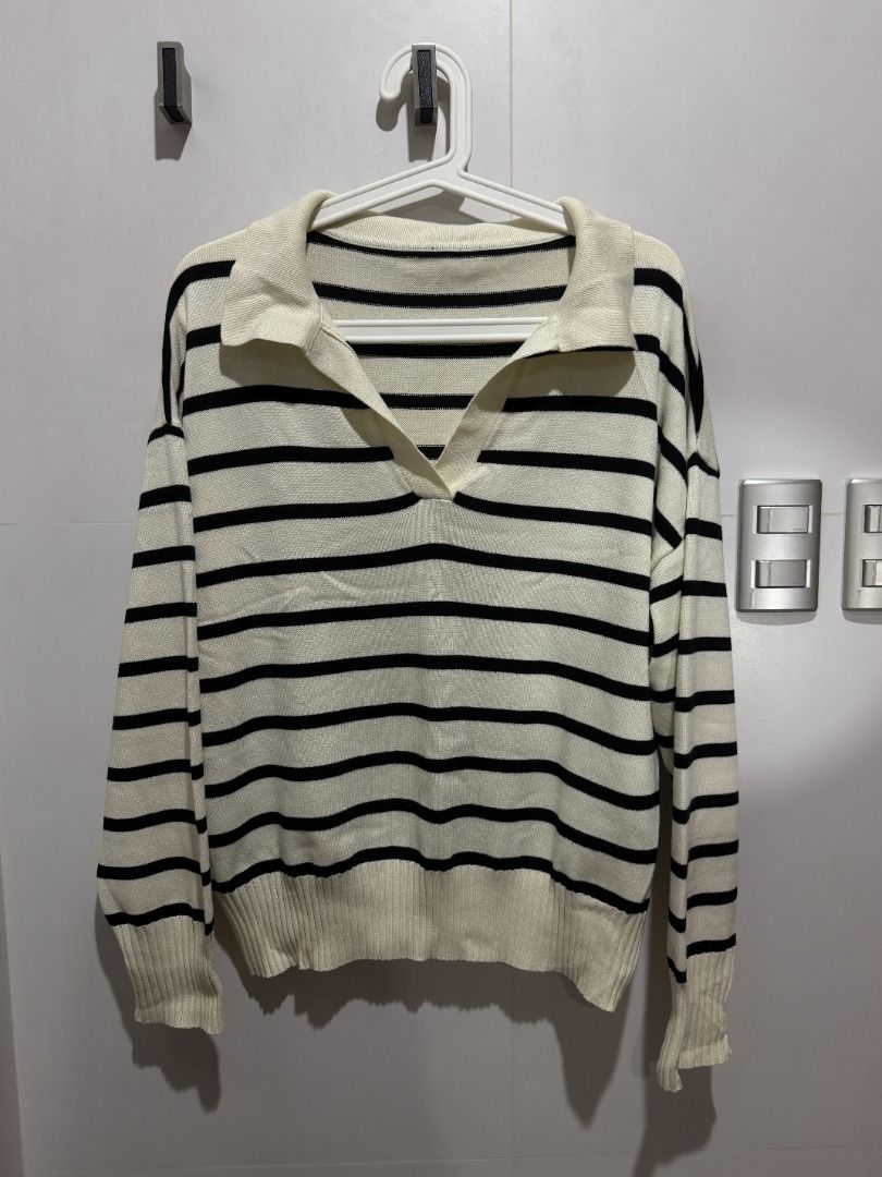 Cream and Black Striped Collared Sweater (Category: Longsleeves) located in Mandaluyong City. Submitted by kayechx (Listing ID 1446496393, Image 1). Description: - Cream sweater with black horizontal stripes - Features a collared neckline - Lightweight knit fabric - Ideal for layering or wearing solo - Versatile styling with jeans or skirts - Bought in Korea - price SLIGHTLY negotiable, but not by a lot huhu already selling cheap since i need clo