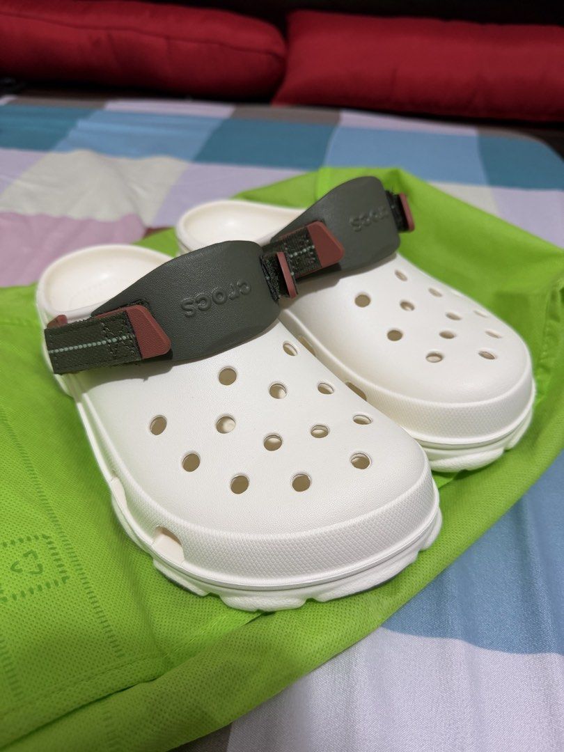Crocs Classic All-Terrain Clog White (Category: Slippers & Slides) located in Mandaluyong City. Submitted by jhaii16 (Listing ID 1446518207, Image 2). Description: - White Crocs Classic All-Terrain Clogs - Rugged sole for enhanced grip - Dark green strap with patterned detail - Easy slip-on and off design - Ideal for everyday wear and outdoor adventures.