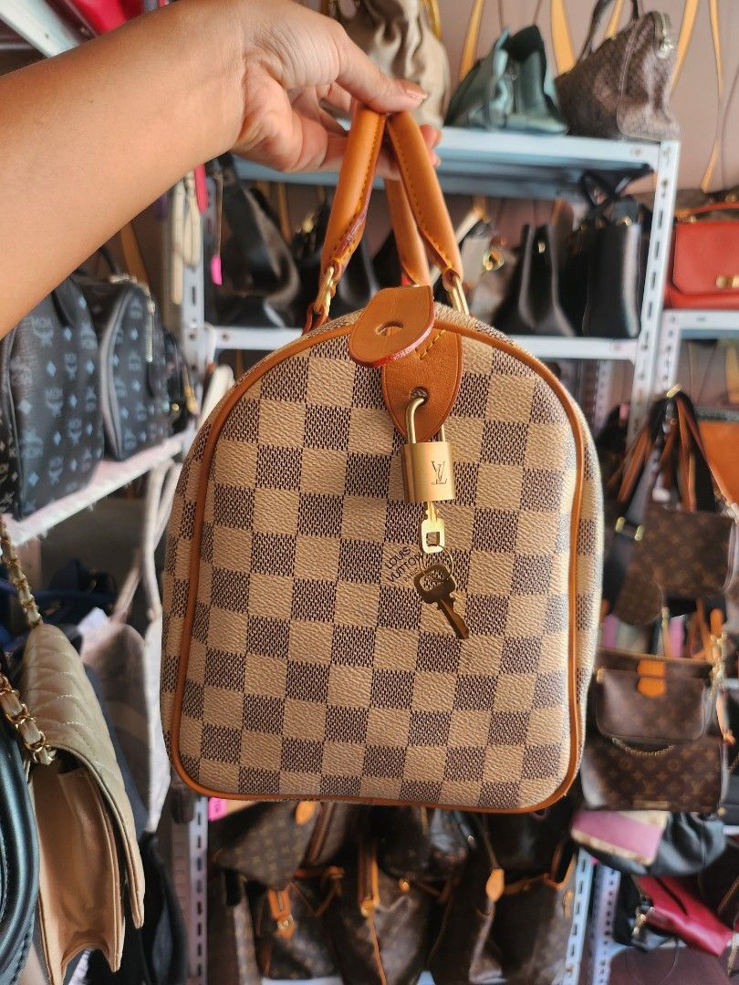 Damier Azur Louis Vuitton Speedy 30 (Category: Tote Bags) located in Caloocan City. Submitted by xcessbaggs (Listing ID 1446418783, Image 2). Description: -Pattern: Damier Azur, a classic blue and white checkered canvas inspired by the French Riviera. -Trim: Natural Vachetta leather that develops a darker amber patina over time. -Hardware: Polished gold-toned metal hardware, including the branded handle rivets. In good pre-loved condition from Ko