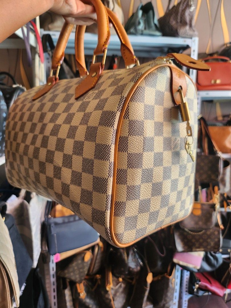 Damier Azur Louis Vuitton Speedy 30 (Category: Tote Bags) located in Caloocan City. Submitted by xcessbaggs (Listing ID 1446418783, Image 3). Description: -Pattern: Damier Azur, a classic blue and white checkered canvas inspired by the French Riviera. -Trim: Natural Vachetta leather that develops a darker amber patina over time. -Hardware: Polished gold-toned metal hardware, including the branded handle rivets. In good pre-loved condition from Ko