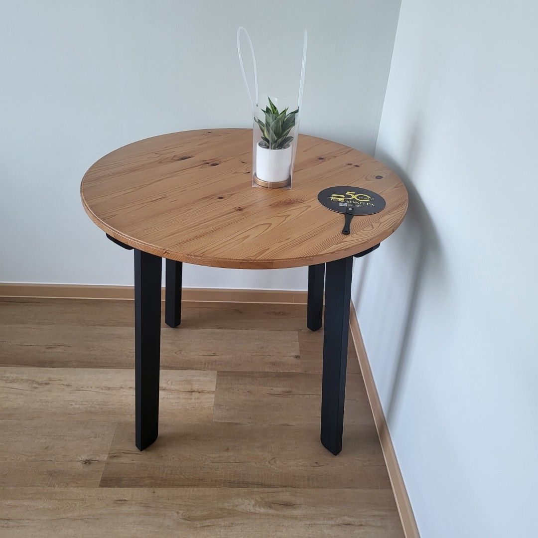 Dining table (Category: Tables & Sets) located in Singapore. Submitted by basedinbkk (Listing ID 1446432250, Image 1). Description: - Round dining table with a natural wood grain finish - Sturdy black metal legs for a modern look - Wood tabletop material - Suitable for spaces up to 1.2m - Meetup in Punggol.