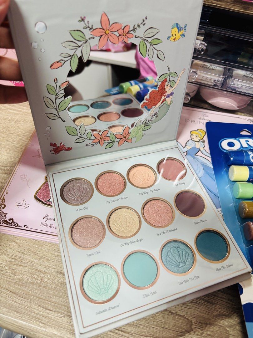 Disney Princess Makeup Palettes + Oreo Lip Balms (Category: Makeup) located in Manila. Submitted by leahamorca44675 (Listing ID 1446469366, Image 2). Description: - Set of 3 Disney Princess themed makeup palettes: Sleeping Beauty, Cinderella, and The Little Mermaid. - Palettes are full-size and include eyeshadow and blush. - Includes a pack of 6 travel-sized Oreo flavored lip balms. - Ideal gift for any Disney fan!.