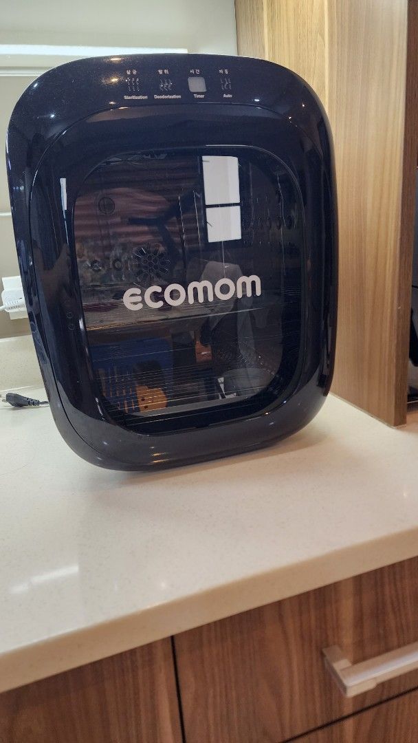 Ecomom Baby Bottle Sterilizer Dryer (Category: Breastfeeding & Bottle Feeding) located in Makati City. Submitted by carwtan90 (Listing ID 1446368037, Image 3). Description: - Ecomom Sterilizer and Dryer - Keeps baby bottles clean and dry - Sleek black and white design - Perfect for busy parents - Simple and easy to operate - Please check photos for detailed condition.