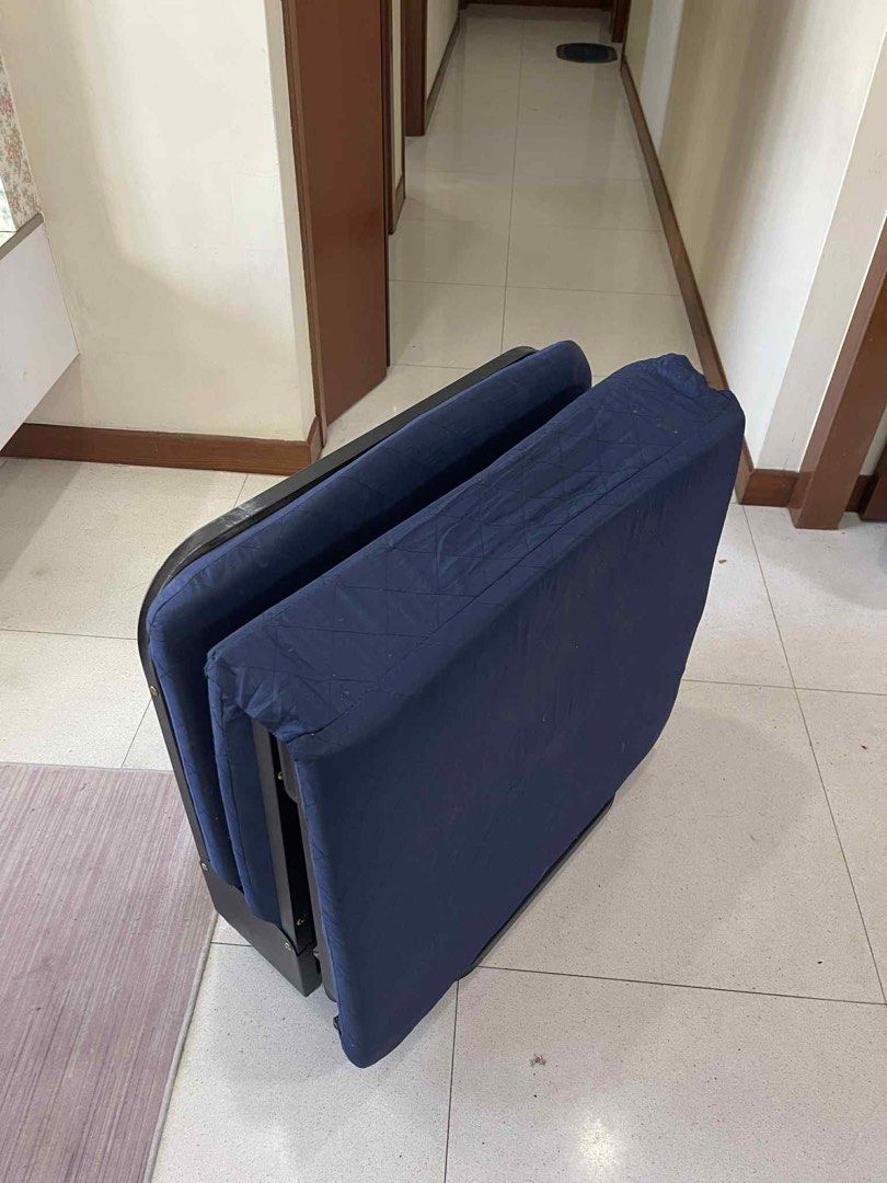 Helper bed (Category: Bed Frames & Mattresses) located in Singapore. Submitted by wn_wd (Listing ID 1446357078, Image 3). Description: - 3-fold bed with comfortable headrest - Folds compactly for easy storage - Built-in wheels for convenient mobility - Unfolded length: 180cm - Ideal for helper .
