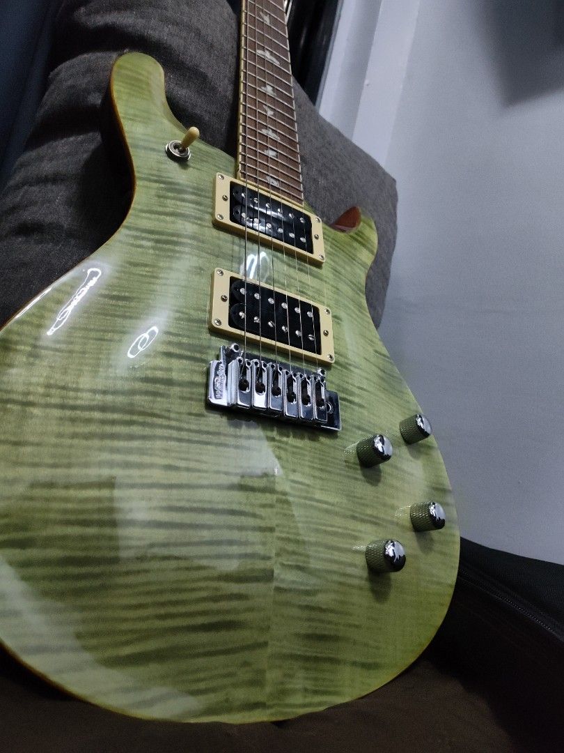 FSO: RJ Tonemaster deluxe plus (Green) (Category: Musical Instruments) located in Quezon City. Submitted by dice117 (Listing ID 1446476857, Image 2). Description: - Used only sa bahay, never used outside, will pass as new talaga.. - Beautiful flamed maple top - Two humbucker pickups - Tremolo bridge - Fretboard with bird inlays - Comes with a gigbag from RJ can meet anywhere in QC. outside NCR will shoulder del fee ng buyer. can send vid for refe
