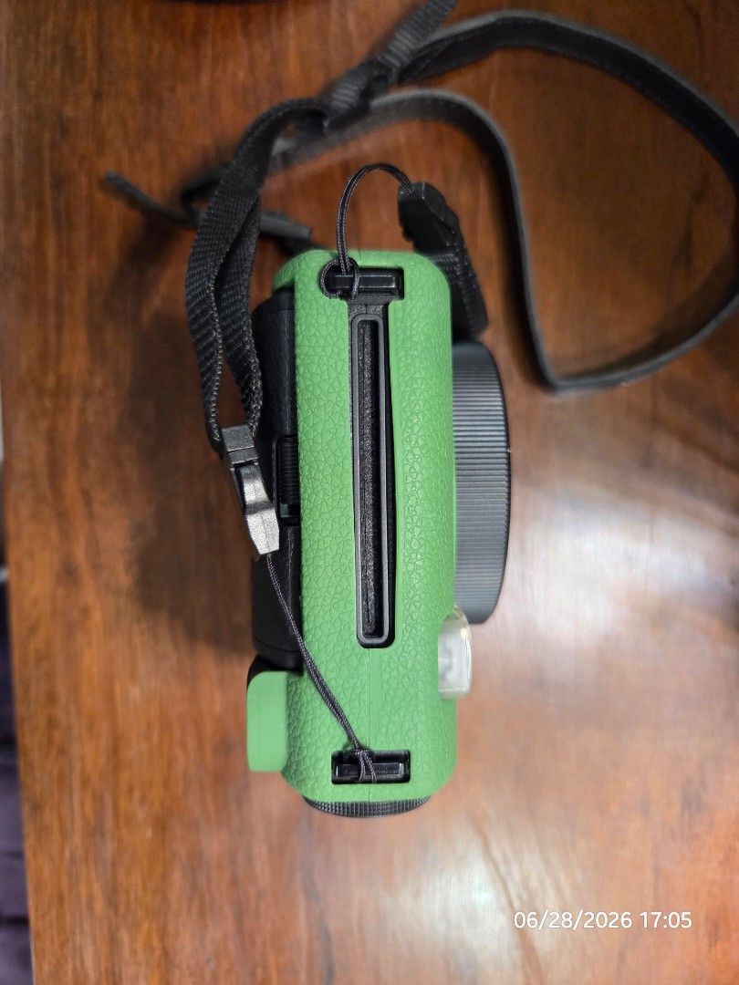 Fujifilm Instax Mini 99 Instant Camera (Category: Cameras) located in Quezon City. Submitted by irvinyow (Listing ID 1442345639, Image 3). Description: Fujifilm Instax Mini 99 camera - Latest model available - Color: Black - With box and silicone case, green - RFS: Not being used anymore.