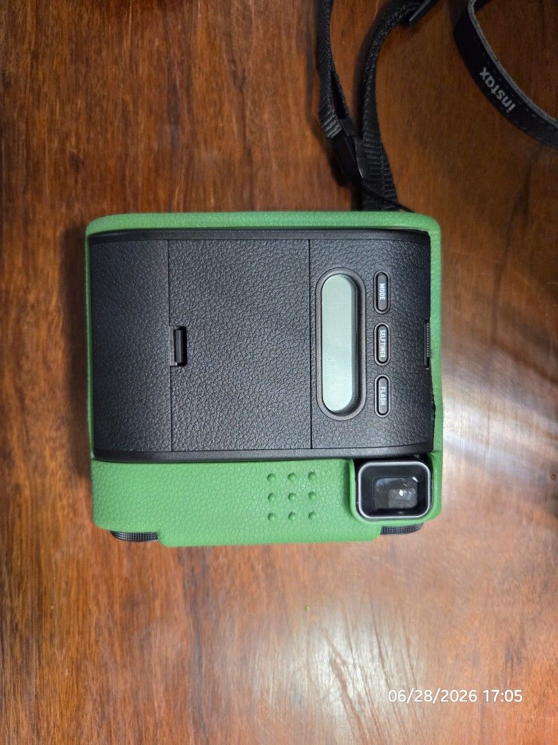 Fujifilm Instax Mini 99 Instant Camera (Category: Cameras) located in Quezon City. Submitted by irvinyow (Listing ID 1442345639, Image 2). Description: Fujifilm Instax Mini 99 camera - Latest model available - Color: Black - With box and silicone case, green - RFS: Not being used anymore.