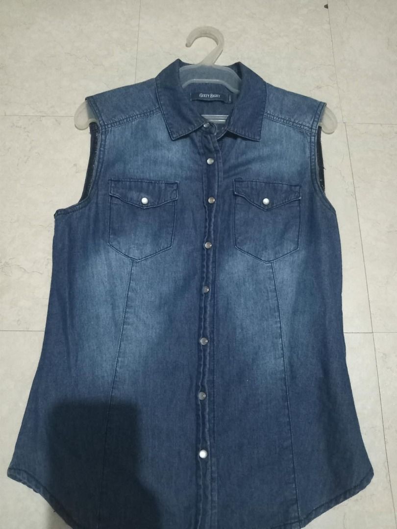 G2Y Denim Sleeveless Shirt (Category: Sleeveless) located in Cavite. Submitted by dmprelovedclothes (Listing ID 1446365983, Image 1). Description: - Sleeveless blue denim shirt - Button-up front with two chest pockets - Classic collar - Estimated size: Medium - Ideal for layering or wearing solo - Versatile addition to casual outfits Used onced (can pass as brandnew) 9/10 condition *Color may vary due to lighting *Please manage your expectations 