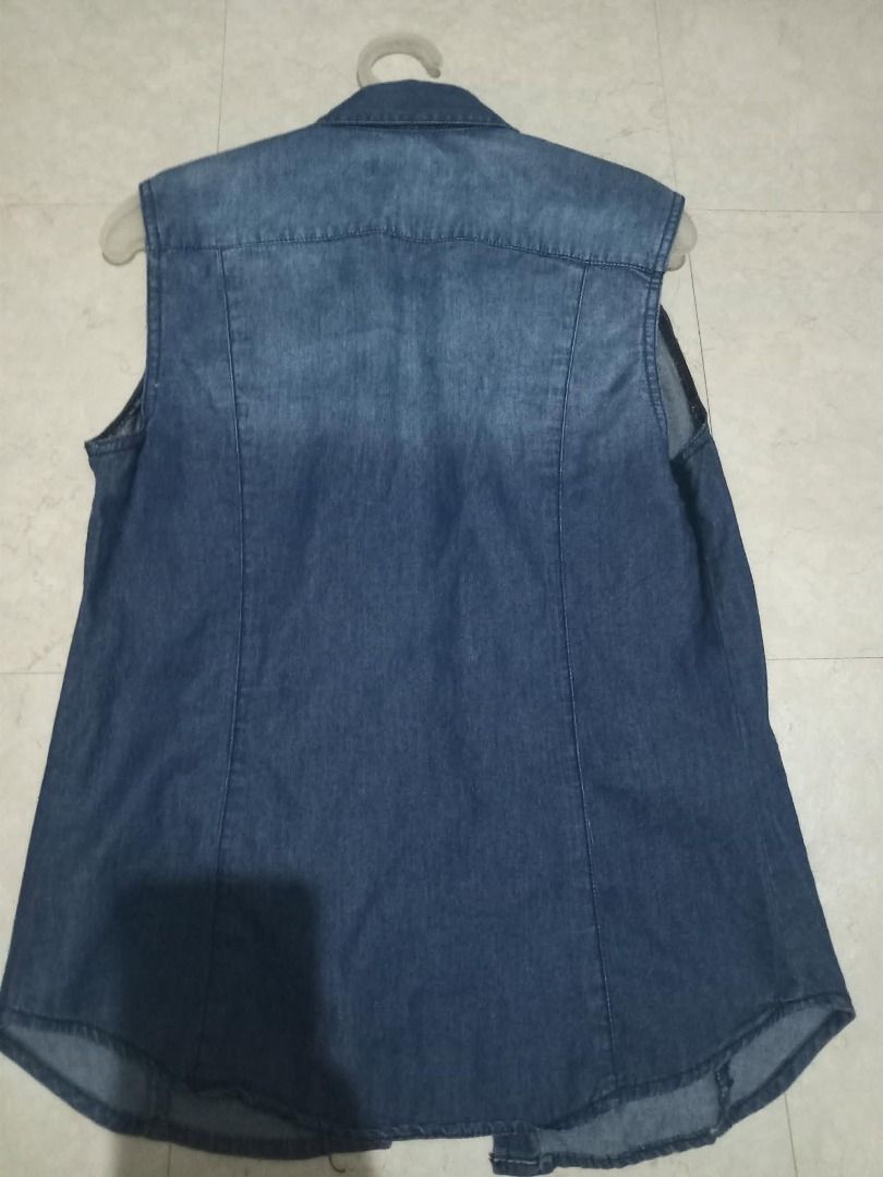 G2Y Denim Sleeveless Shirt (Category: Sleeveless) located in Cavite. Submitted by dmprelovedclothes (Listing ID 1446365983, Image 2). Description: - Sleeveless blue denim shirt - Button-up front with two chest pockets - Classic collar - Estimated size: Medium - Ideal for layering or wearing solo - Versatile addition to casual outfits Used onced (can pass as brandnew) 9/10 condition *Color may vary due to lighting *Please manage your expectations 