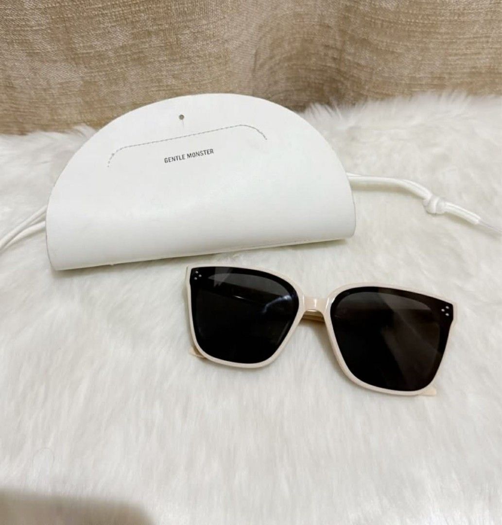 Gentle Monster Sunglasses with Case (Category: Sunglasses & Eyewear) located in Caloocan City. Submitted by mommyella22 (Listing ID 1446480605, Image 1). Description: - Brand: Gentle Monster - Frame Color: Cream - Lens Color: Black - Includes: Original white case - Perfect for: Sunny days.