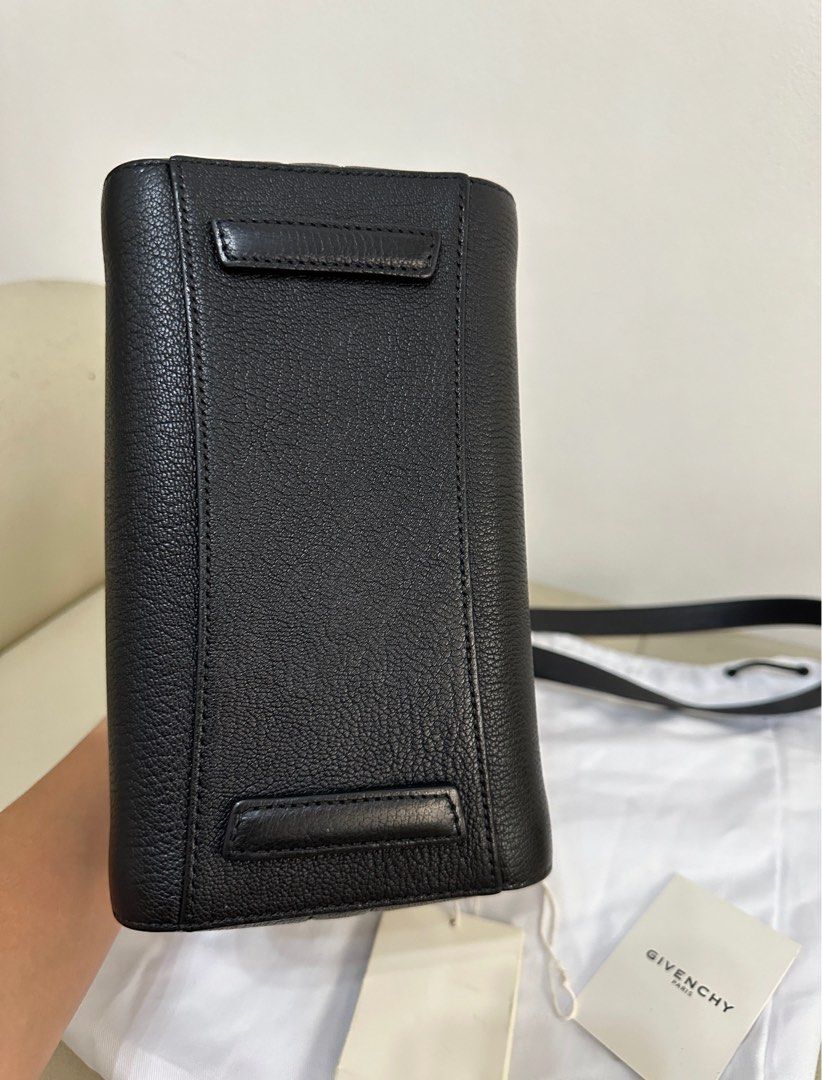 Givenchy Black Leather Antigona Mini Bag (Category: Luxury Bags & Wallets) located in Mandaluyong City. Submitted by ayesesey (Listing ID 1446416707, Image 2). Description: Authentic Givenchy Antigona Mini handbag in black goat leather. Features a top zip closure, two top handles, and a detachable shoulder strap. Includes a dust bag, tags, and a small leather swatch. The interior is lined. Silver-tone hardware. Condition: Pre-loved condition with