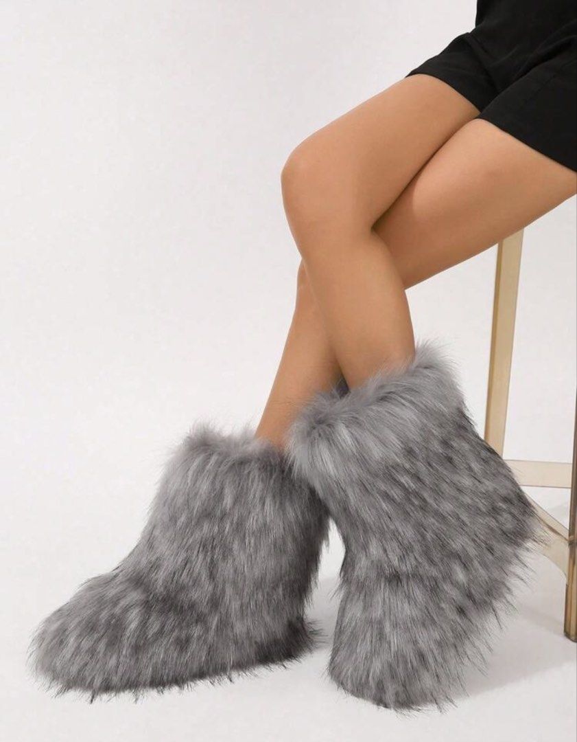 Grey Faux Fur Winter Boots (Category: Boots) located in Taguig. Submitted by wardrobebymami (Listing ID 1446474180, Image 2). Description: - Size 6 - Rfs: don’t use it anymore - og price: 1,700+ - Super cozy grey boots - Soft and fluffy faux fur lining for ultimate warmth - Easy slip-on design - Ideal for cold weather - Adds a fun statement to any outfit.