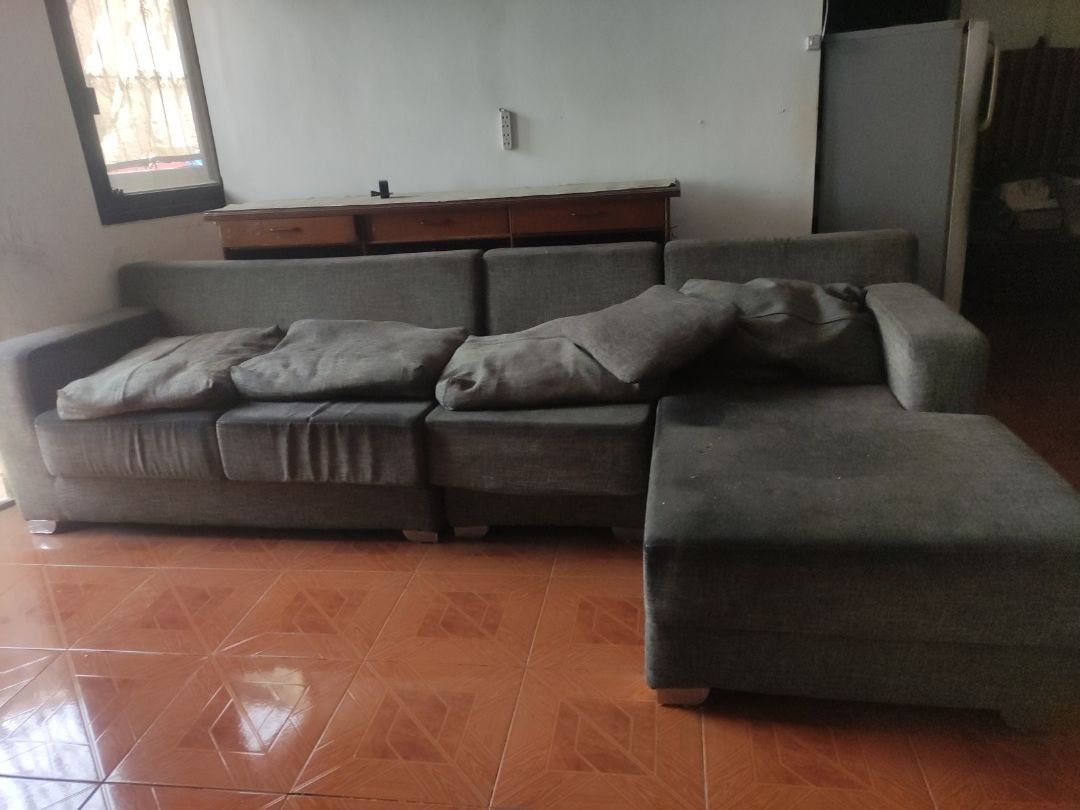 Grey L-shaped Sectional Sofa with Ottoman (Category: Sofas) located in Batangas. Submitted by alcorner (Listing ID 1446362563, Image 2). Description: - Grey L-shaped sectional sofa - Ample seating space, perfect for families or entertaining - Comfortable cushions included - Durable fabric upholstery - Ideal for living rooms or larger home spaces - Ready for a new home!.