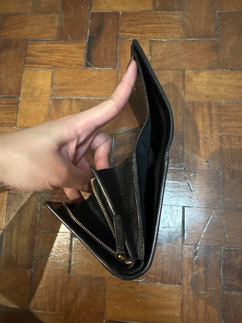 Gucci GG Supreme Bi-Fold Wallet (Category: Luxury Bags & Wallets) located in Mandaluyong City. Submitted by ayesesey (Listing ID 1446417377, Image 3). Description: - Authentic Gucci wallet - Classic GG monogram canvas with black leather trim - Secure snap button closure - Internal zip coin pocket - Multiple card slots and compartments - Comes with original box, dust bag, and authenticity card - Ideal for everyday use.
