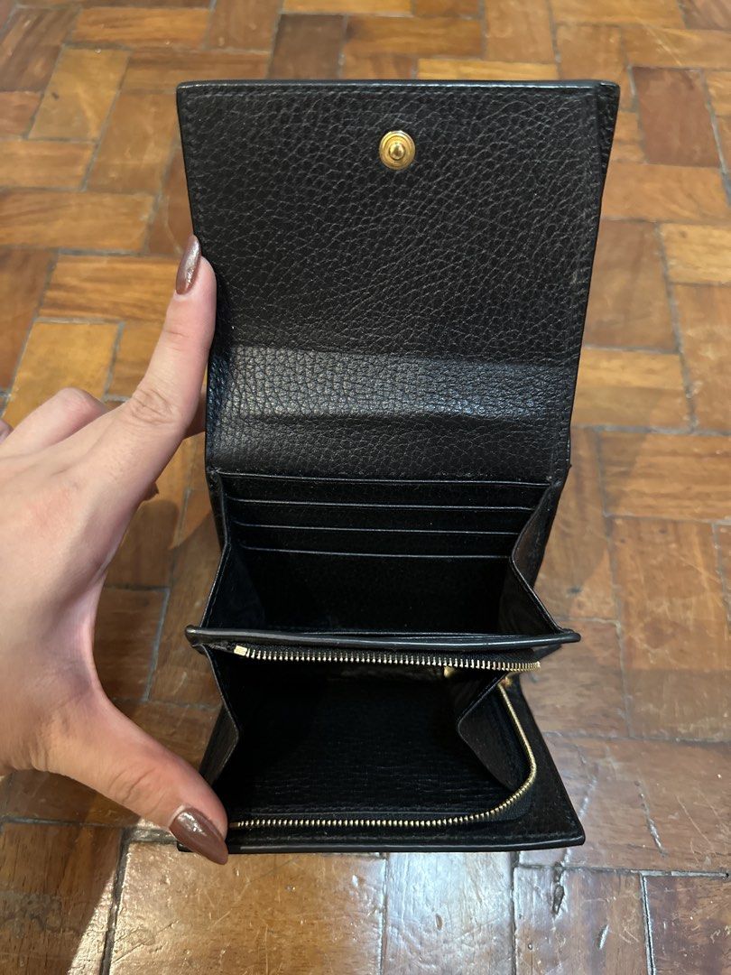 Gucci GG Supreme Bi-Fold Wallet (Category: Luxury Bags & Wallets) located in Mandaluyong City. Submitted by ayesesey (Listing ID 1446417377, Image 2). Description: - Authentic Gucci wallet - Classic GG monogram canvas with black leather trim - Secure snap button closure - Internal zip coin pocket - Multiple card slots and compartments - Comes with original box, dust bag, and authenticity card - Ideal for everyday use.