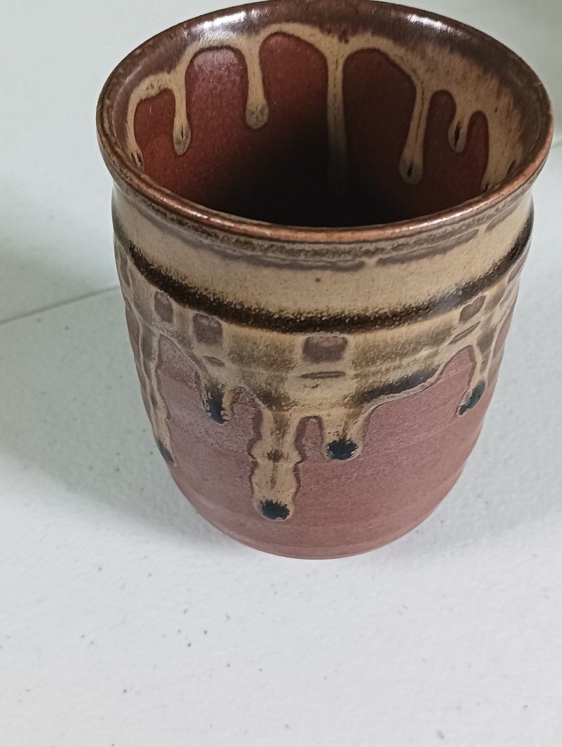 Handmade Ceramic Tea Cup with Drip Glaze (Category: Coffee & Tea Tableware) located in Manila. Submitted by iamwhilmz (Listing ID 1446355611, Image 3). Description: - Unique handmade ceramic cup - Beautiful reddish-brown clay body - Tan drip glaze with dark speckles - Ideal for tea, coffee, or display - Approx. [insert height] tall - Approx. [insert diameter] wide.