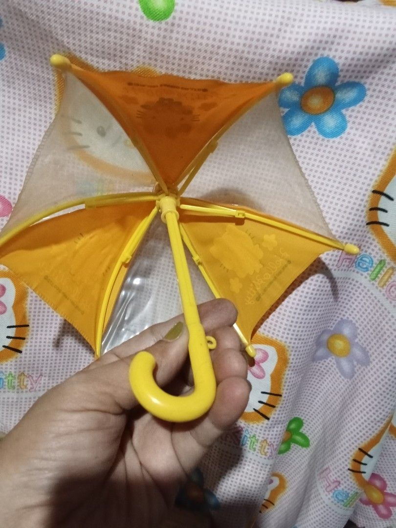 Hello Kitty Mini Umbrella (Category: Umbrellas) located in Bocaue. Submitted by marajapansurplus (Listing ID 1446460692, Image 2). Description: - Adorable yellow Kitty mini umbrella - Features cute flower designs - Bright yellow hook handle - Fun and easy for children to open and close.