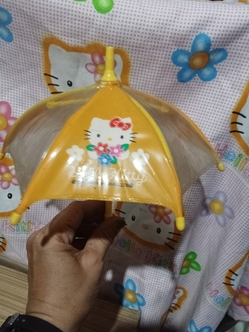 Hello Kitty Mini Umbrella (Category: Umbrellas) located in Bocaue. Submitted by marajapansurplus (Listing ID 1446460692, Image 3). Description: - Adorable yellow Kitty mini umbrella - Features cute flower designs - Bright yellow hook handle - Fun and easy for children to open and close.