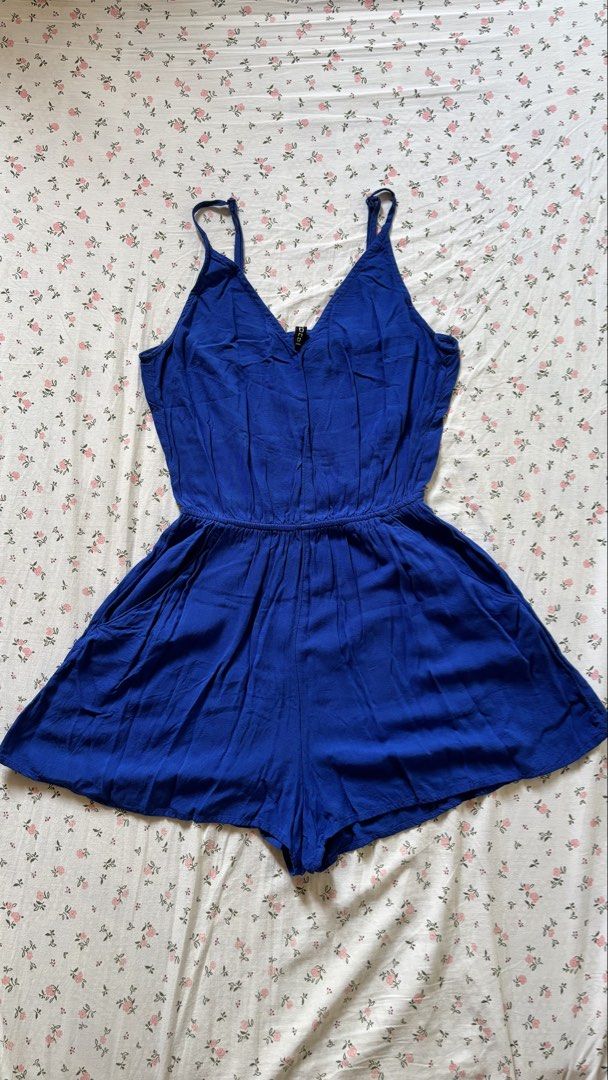 H&M Royal Blue V-Neck Romper (Category: Rompers) located in Lucban. Submitted by ogchic (Listing ID 1446355867, Image 1). Description: - Royal blue romper from H&M - V-neck - Elasticated waist for a comfortable fit - Delicate spaghetti straps - Flared shorts for a stylish silhouette - Versatile for casual days or evening events.