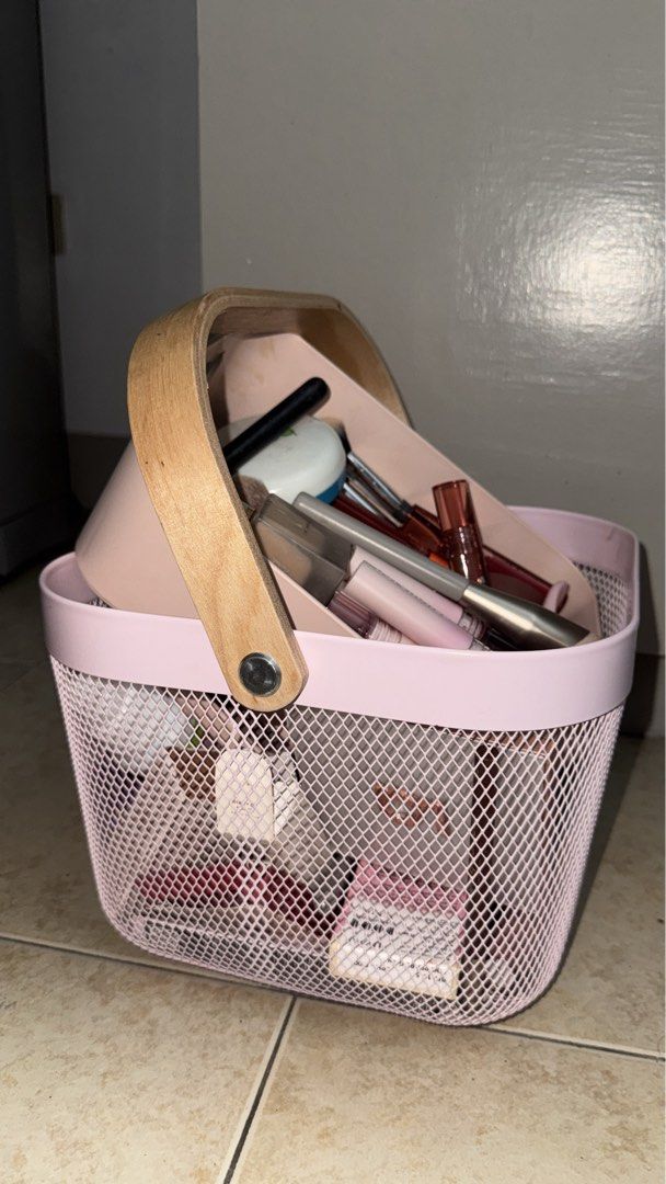 Ikea Pink Wire Basket Risatorp Series (Category: Storage Boxes & Baskets) located in Manila. Submitted by liahsells (Listing ID 1446460577, Image 1). Description: - Cute pink mesh basket - Sturdy wooden handle - Perfect for organizing makeup, skincare, or small essentials - Mesh design for easy visibility - Helps keep your vanity neat and tidy.