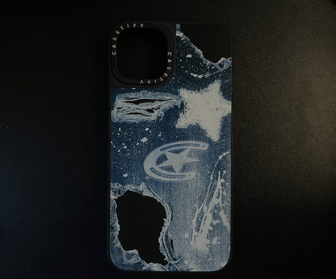 iPhone 13 Casetify Phone Case dupee + FREE (Category: Cases & Sleeves) located in Mandaluyong City. Submitted by namislounge (Listing ID 1446453718, Image 1). Description: iPhone 13 Casetify-inspired Matte phone case (like new) - Unique distressed denim design with star and logo accents - Super tibay and high quality! with FREE: Navy Blue Phone Case (for iPhone 13) that features a built-in ring holder for easy grip and viewing .