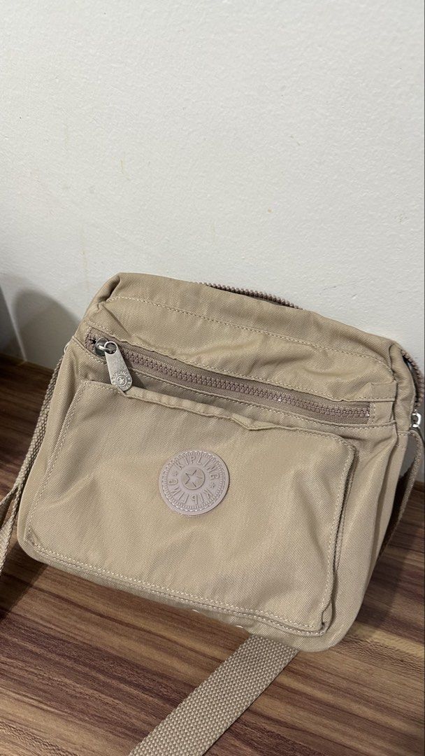 Kipling Crossbody abag (Category: Cross-body Bags) located in Manila. Submitted by vrnykshv (Listing ID 1446475849, Image 1). Description: used mga five times lang during travel abroad may minimal stain sa ilalim which i think is washable naman not using it anymore Location: Makati.