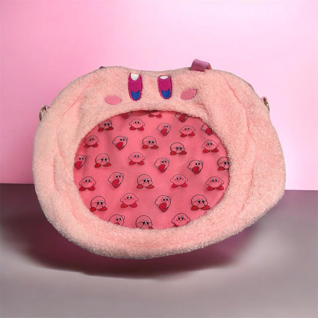 Nintendo Kirby Sling Bag - (see through pocket) (Category: Sling Bags) located in General Trias. Submitted by aizapandecluttershop (Listing ID 1446532943, Image 1). Description: Used 1 lang po, from japan.. super cute nya.. see through pocket.. Madami kayo pwede ilagay.. may sling po sya...