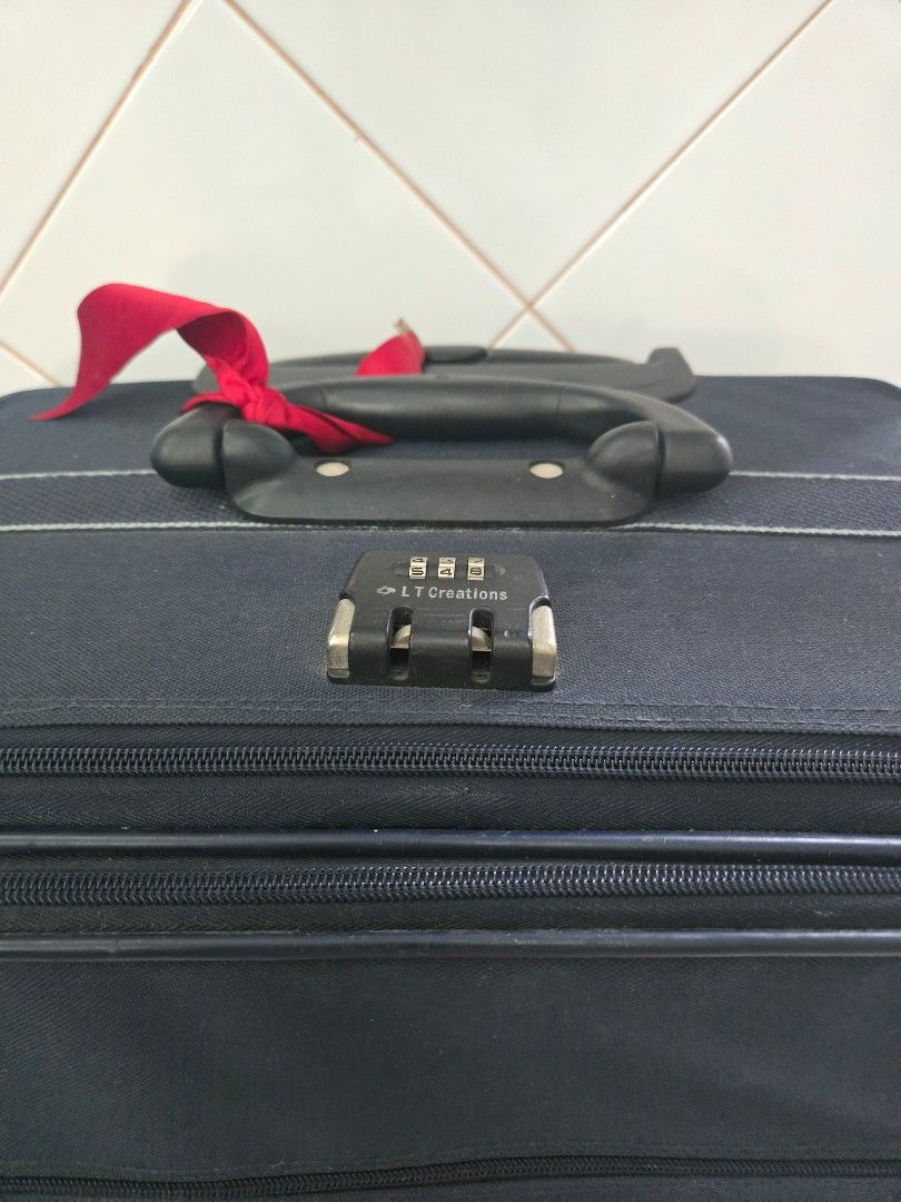 LARGE LT Creations Navy Blue Luggage with Combination Lock (Category: Luggage) located in Quezon City. Submitted by samcas (Listing ID 1446390874, Image 2). Description: Navy blue LT Creations suitcase with built-in combo lock. Sturdy handles and zippers. Organized interior. Perfect for your next trip! height: 27.5" width: 18" depth: 10.5" .