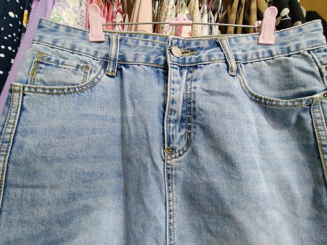 Light Wash Denim Midi Skirt with Back Slit (Category: Skirts) located in Manila. Submitted by jadmcl (Listing ID 1446412623, Image 2). Description: - Classic light wash denim midi skirt - Comfortable fit with a back slit for easy movement - Two front pockets and two back pockets - Brand tag visible on back pocket - Versatile for casual outfits, pairs easily with tops and shoes.