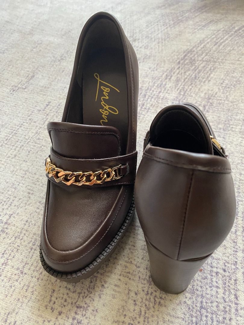 London Rag Boot High Heels (Category: Heels) located in Kuala Lumpur. Submitted by nchammer (Listing ID 1446347319, Image 2). Description: - Brand: London Rag - Size: UK 6 / US 8 / EU 39 - Condition: Like new, worn only one - Style: Chunky platform loafers - Colour: Dark brown - Detail: Gold chain across the front - Heel: Substantial block heel - Sole: Grippy sole - Original box included - Versatile: Great for dressing up or down - RRP: RM259.