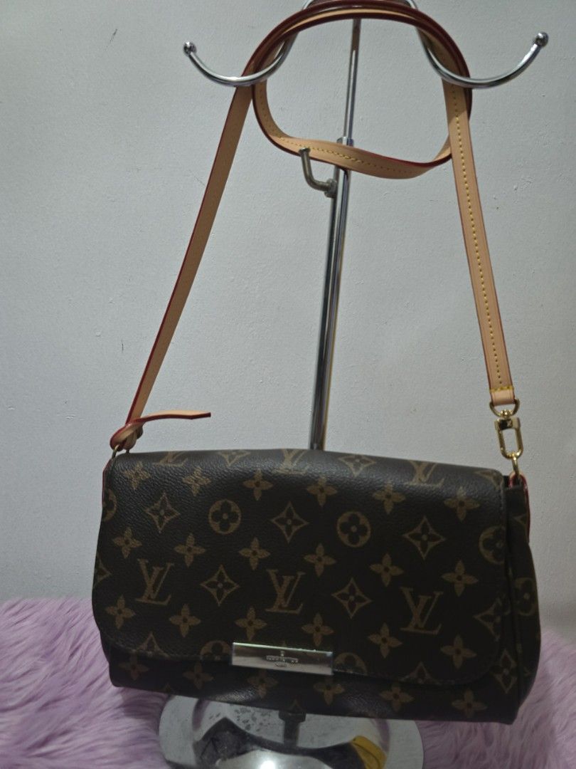Louis Vuitton Monogram Canvas Shoulder Bag (Category: Luxury Bags & Wallets) located in Pasig City. Submitted by zealfish.3d4f32 (Listing ID 1446475945, Image 1). Description: - Classic Louis Vuitton monogram canvas shoulder bag - Tan leather strap and trim - Interior: Main compartment and a slip pocket - Gold-tone hardware - Ideal for everyday use.