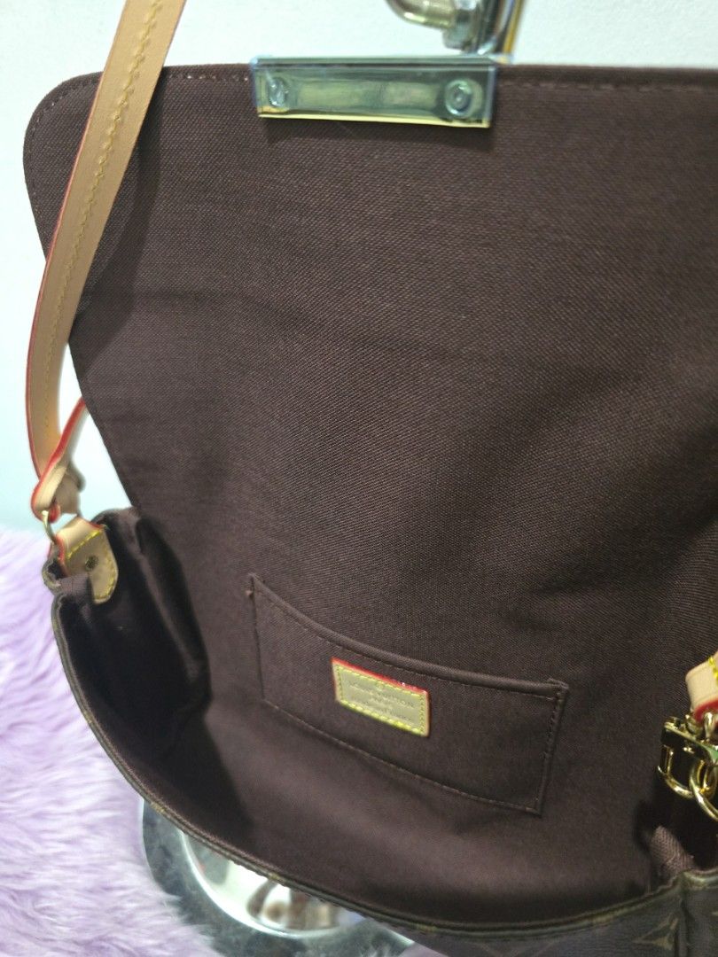Louis Vuitton Monogram Canvas Shoulder Bag (Category: Luxury Bags & Wallets) located in Pasig City. Submitted by zealfish.3d4f32 (Listing ID 1446475945, Image 2). Description: - Classic Louis Vuitton monogram canvas shoulder bag - Tan leather strap and trim - Interior: Main compartment and a slip pocket - Gold-tone hardware - Ideal for everyday use.