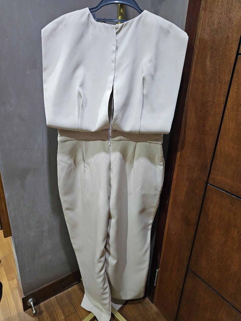 Love, Bonito Beige Jumpsuit Size L (Category: Dresses) located in Paranaque City. Submitted by laraaa_csf (Listing ID 1446390389, Image 2). Description: - Beige jumpsuit from Love, Bonito - Size L - Features a flattering tie waist detail - Made from good quality material - Used once only for pictorial - Versatile: great for events or work - Kept in closet after using.