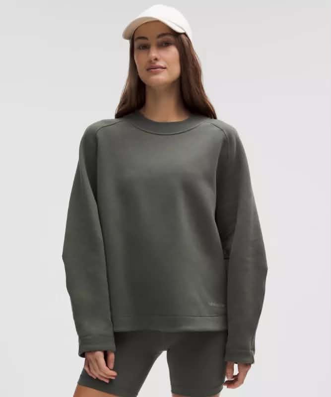 Lululemon jacket (Category: Activewear) located in Singapore. Submitted by kenmarjorie (Listing ID 1446353683, Image 1). Description: Used no odor no stain no damage add for mailing Lululemon Perfectly Oversized Crew Pullover Description - size 12 - no damage - desaturated Blue-Green Earth tone - 100% cotton.