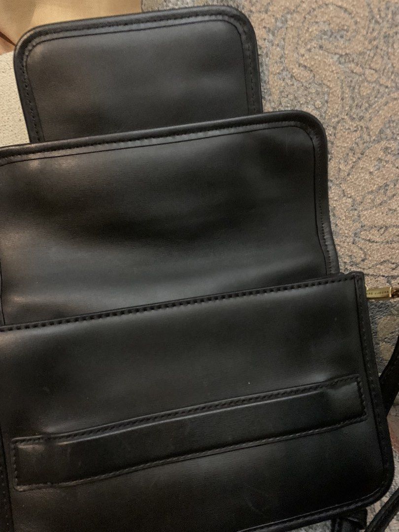Marc Jacobs Madison Black Leather Crossbody Bag (Category: Luxury Bags & Wallets) located in Paranaque City. Submitted by imnotlizzie (Listing ID 1446484094, Image 3). Description: - Authentic Marc Jacobs black leather crossbody bag - Front zip pocket - Gold hardware - Adjustable strap - With light scratches - Available for delivery via Lalamove, Grab, or GoGo Express.