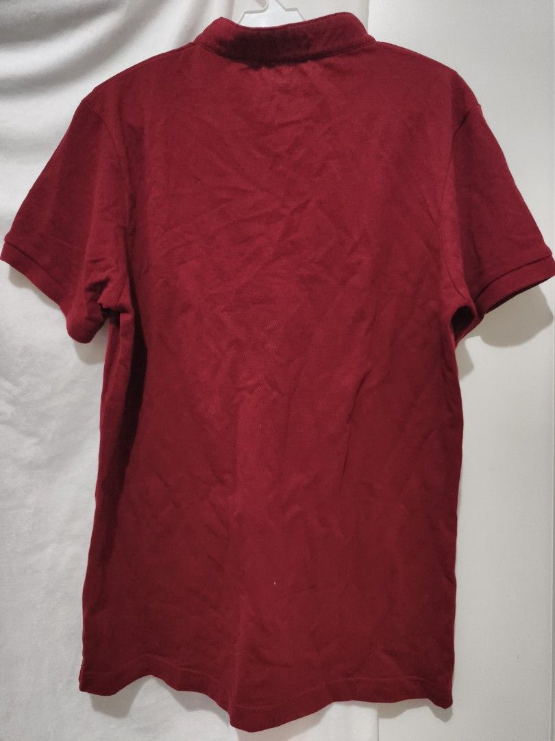 Maroon Short Sleeve Polo Shirt (Category: Tshirts & Polo Shirts ) located in Muntinlupa City. Submitted by cozmovingout (Listing ID 1446496274, Image 2). Description: - Classic maroon polo shirt - Short sleeves - Simple and versatile design - Perfect for casual wear - Great for layering - Easy to match with various outfits - A wardrobe essential.