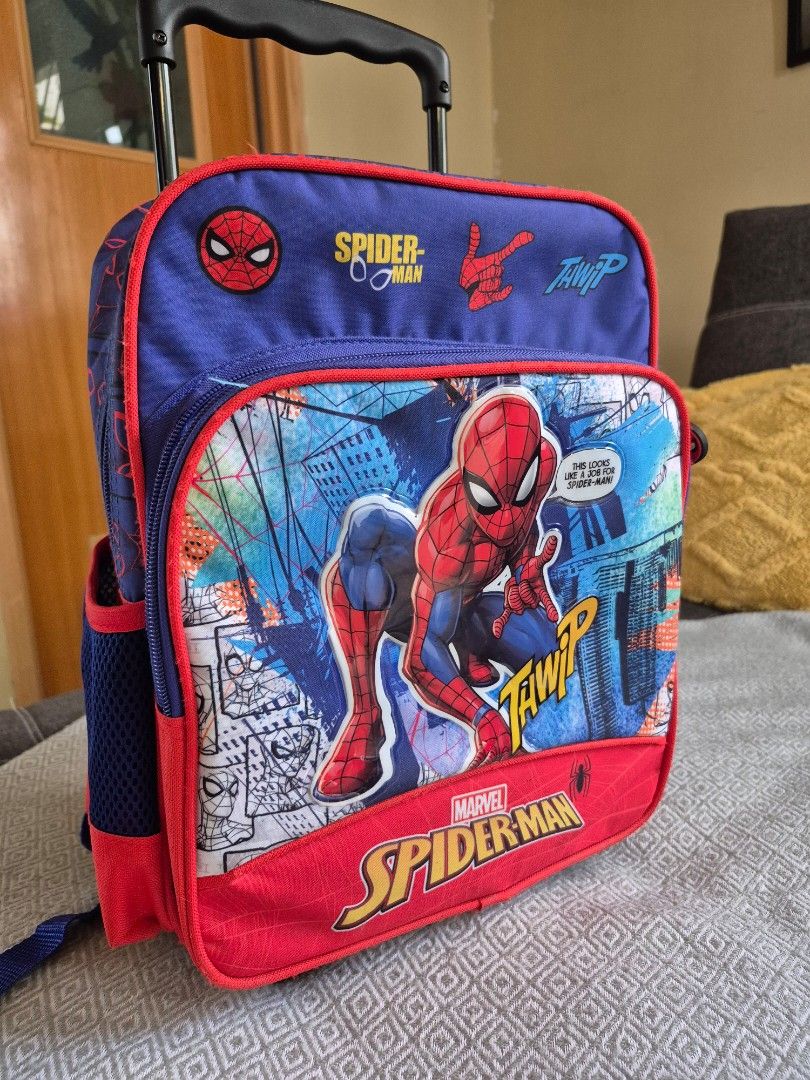 Marvel Spider-Man Rolling Backpack with Wheels (Category: Backpacks) located in Cavite. Submitted by 3K_finds (Listing ID 1446370087, Image 2). Description: - Cool Spider-Man rolling backpack for kids - Features a fun comic-style graphic of Spidey in action - Retractable handle and wheels for easy transport - Shoulder straps for carrying option - Zippers with cute Spider-Man mask pulls - Ideal for school or travel adventures.