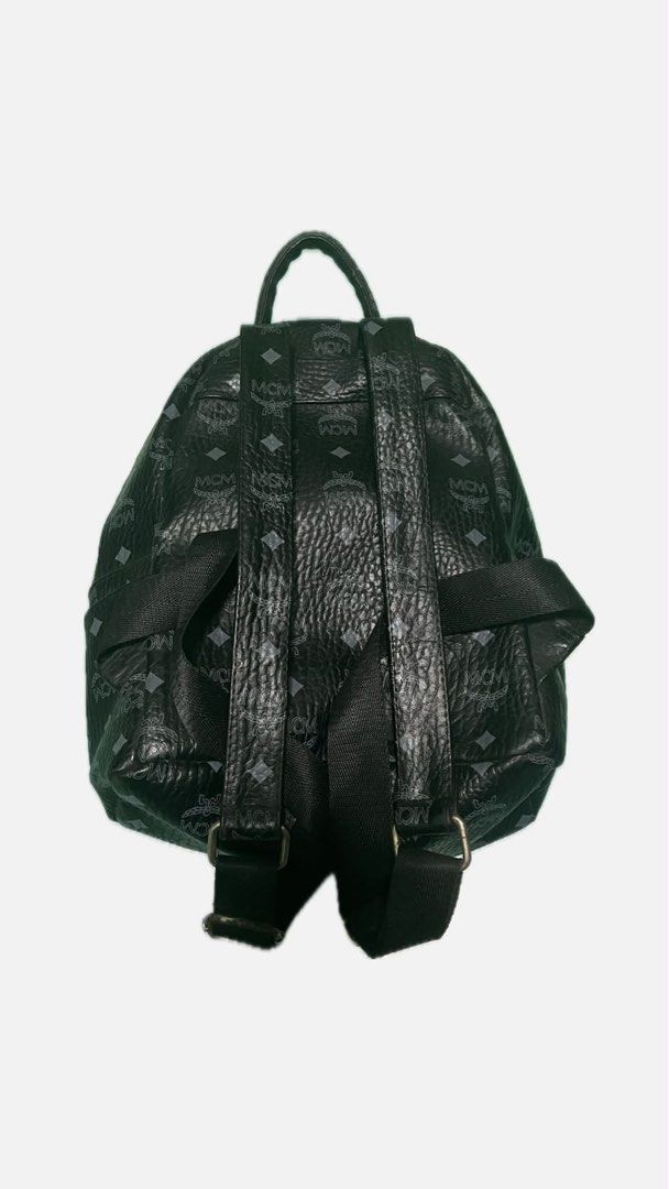 MCM Studded Monogram Backpack Black (Category: Luxury Bags & Wallets) located in Makati City. Submitted by preloved_plc (Listing ID 1446359856, Image 3). Description: - Authentic black MCM backpack - Signature monogram print - Decorative silver-tone studs on front - Main compartment with interior pocket - Adjustable shoulder straps - Minor signs of wear on hardware and straps.